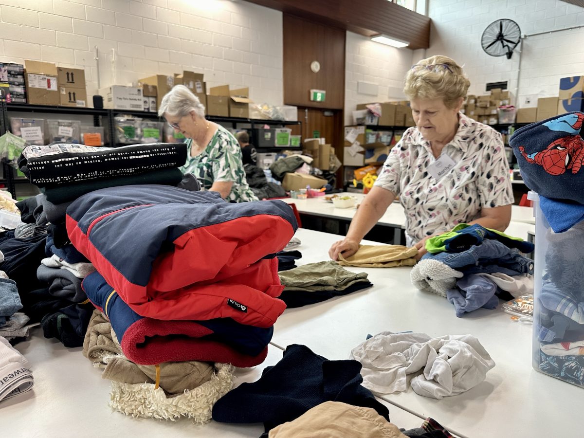 women sorting clothing