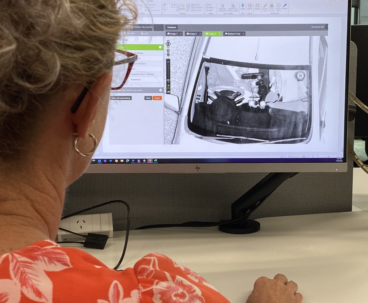 woman looking at computer screen