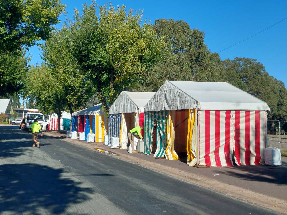 workers setting up folk festival