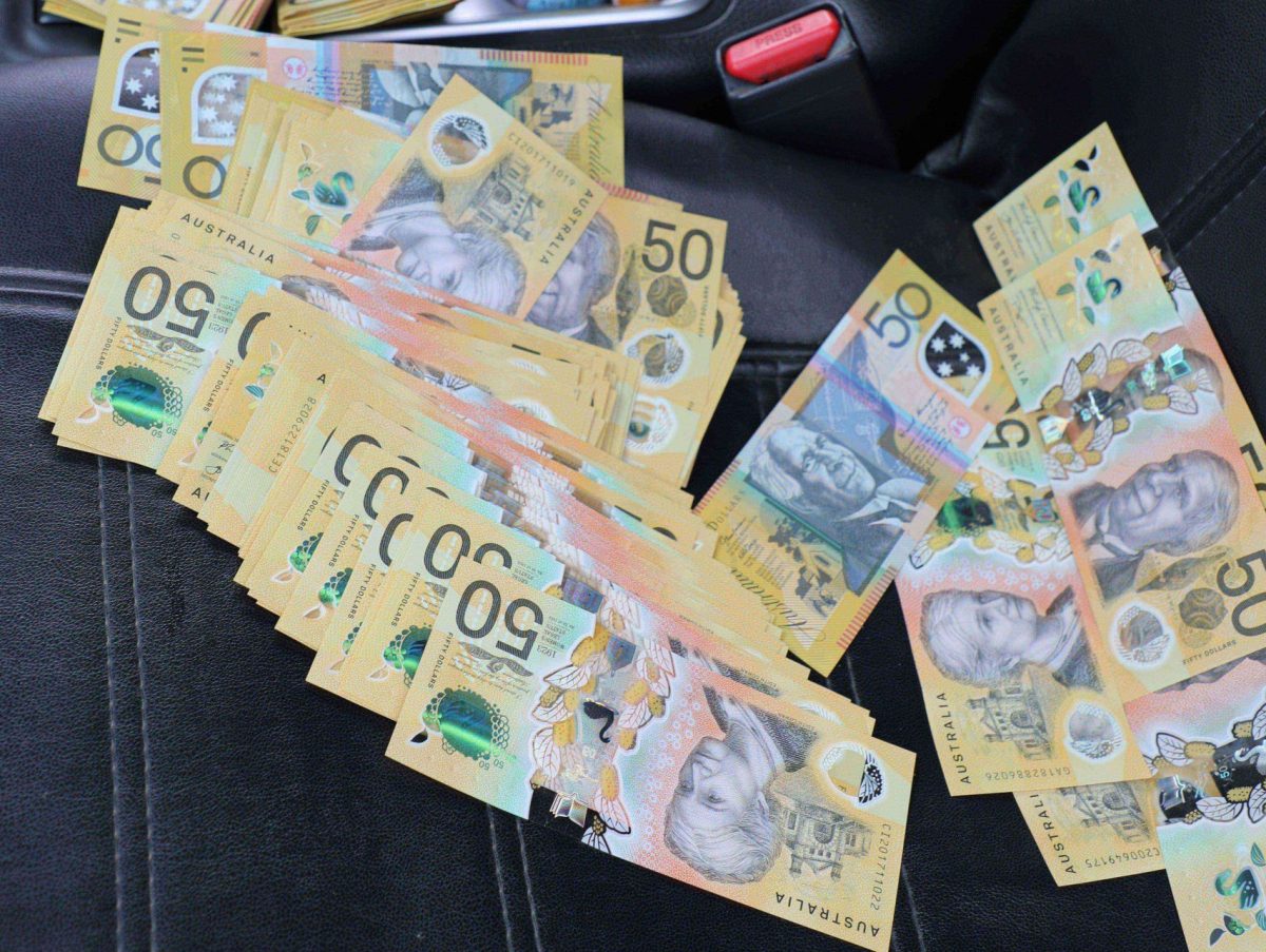 $50 notes on a car seat