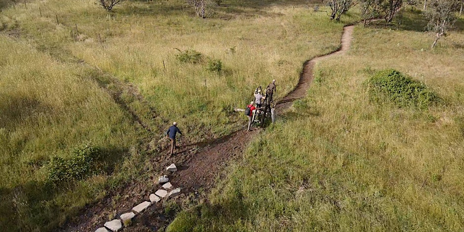 People walking on a track through the Ginninderry Conservation Corridor