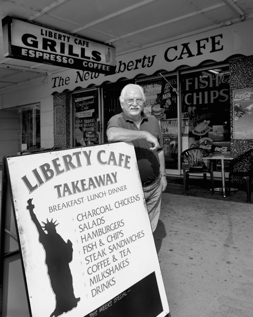 Con Zervos leaning on Liberty Cafe sign