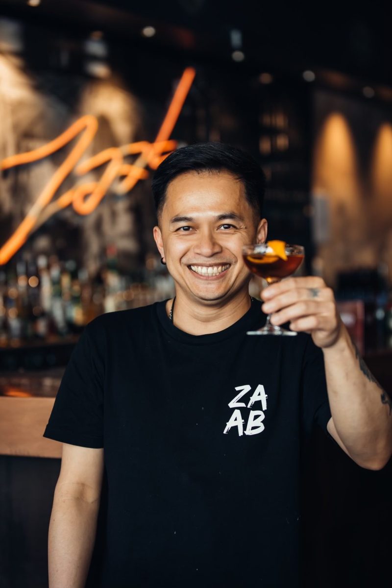 A man holding a glass