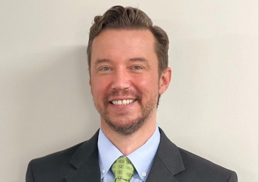 portrait of man with green tie