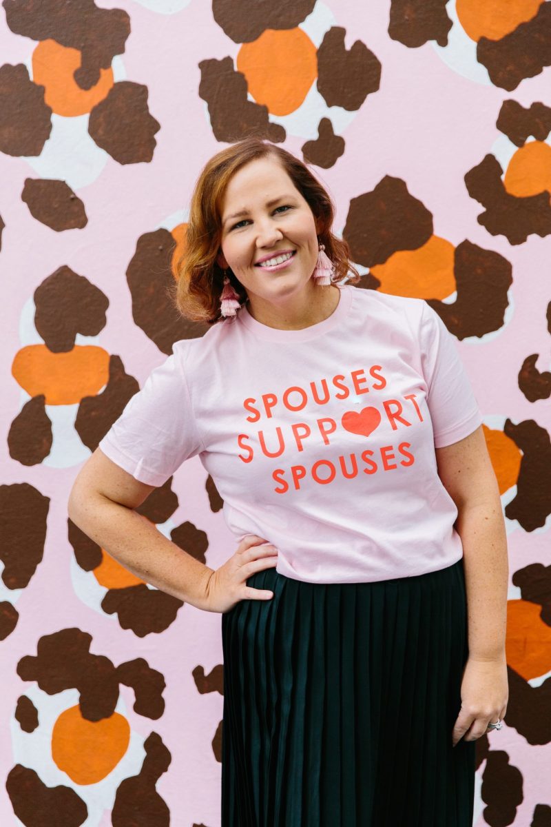 Beck Rayner wearing shirt saying Spouses Support Spouses