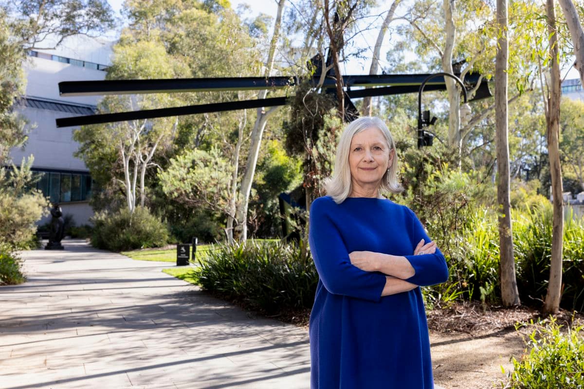 woman standing in sculpture garden