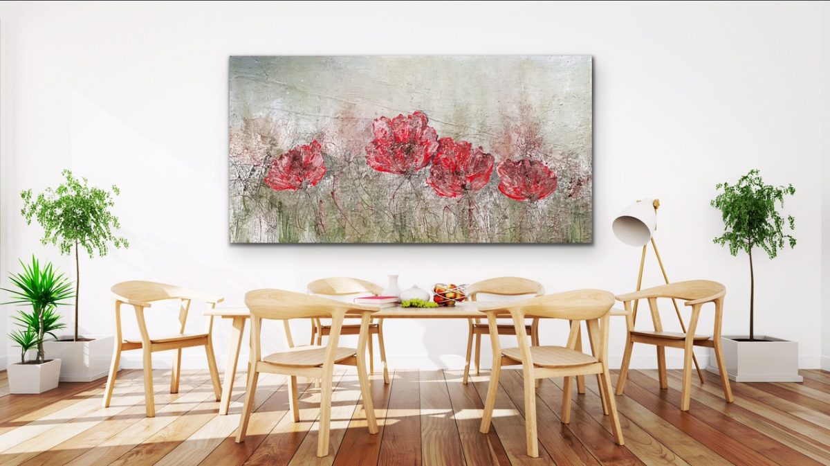 Dining room with red abstract artwork hung on the wall