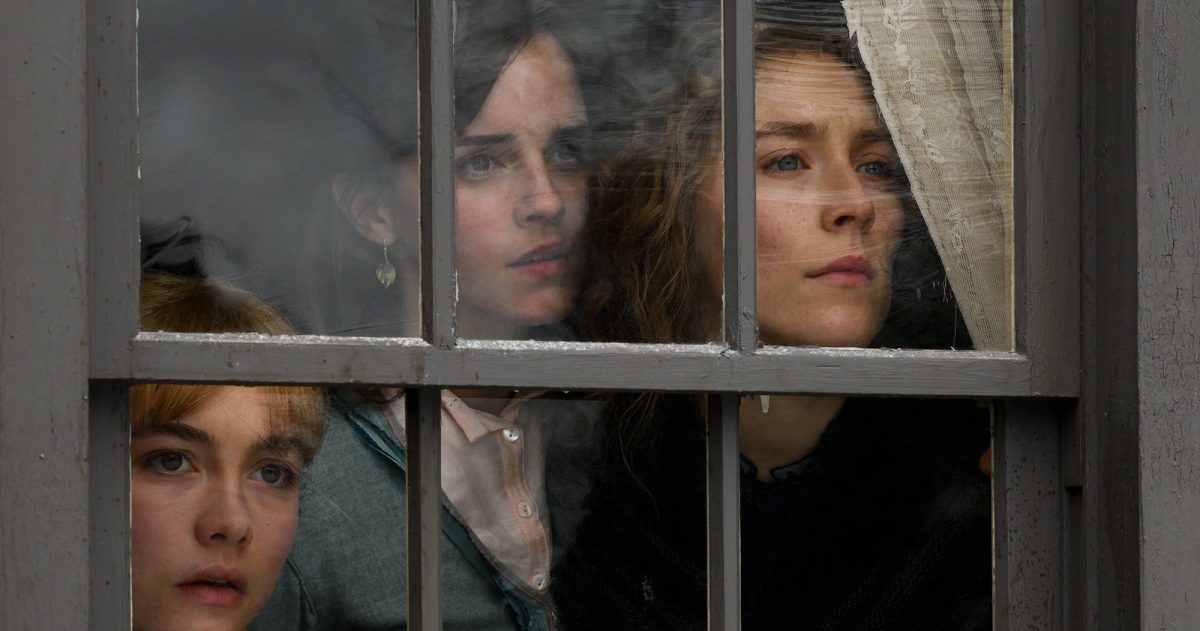 Still from Little Women showing three young women looking out a window