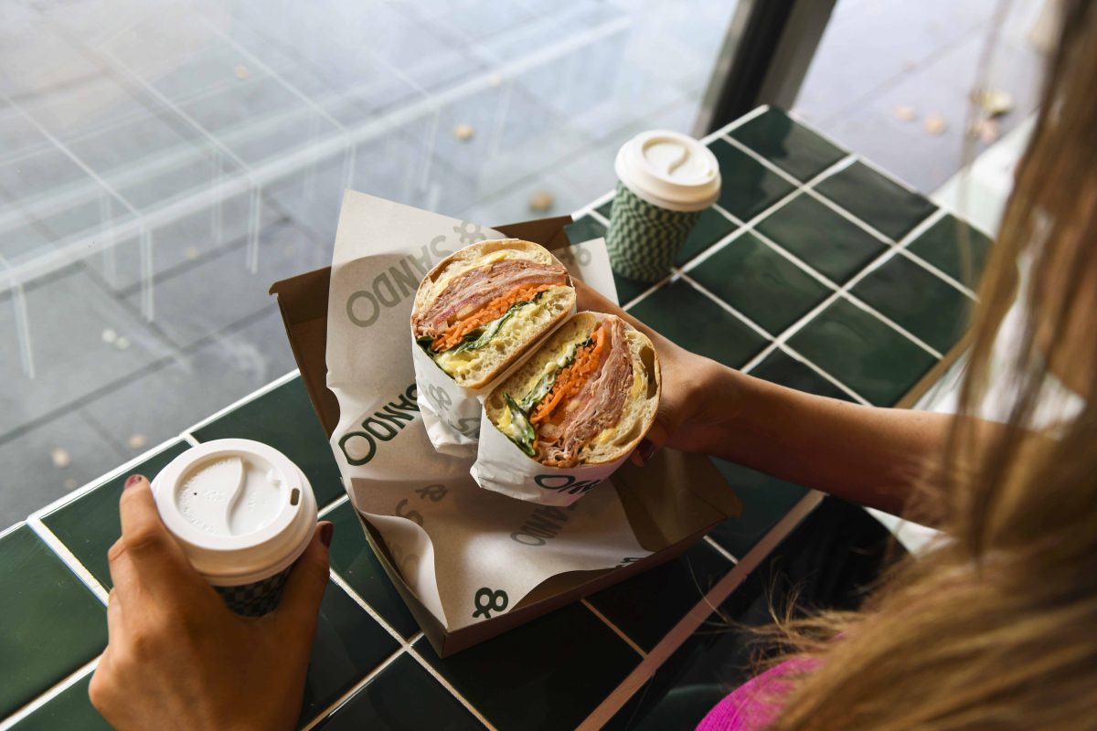 Sandwich with green tiles and takeaway coffee cups
