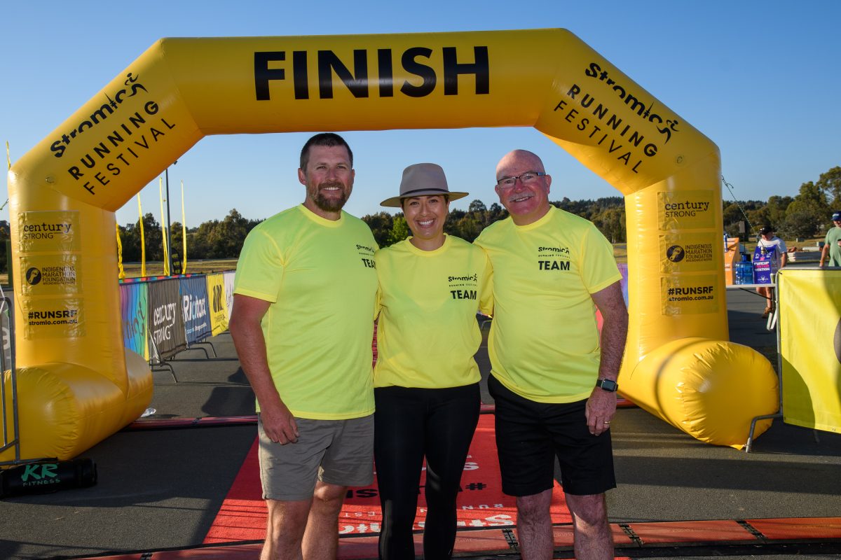 Three people a the Stromlo Running Festival finish line