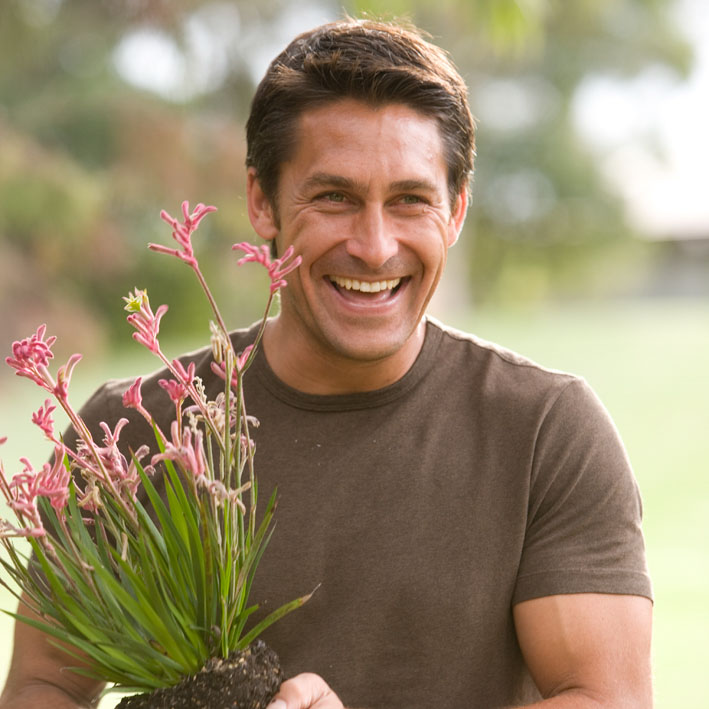 Jamie Durie holding a plant