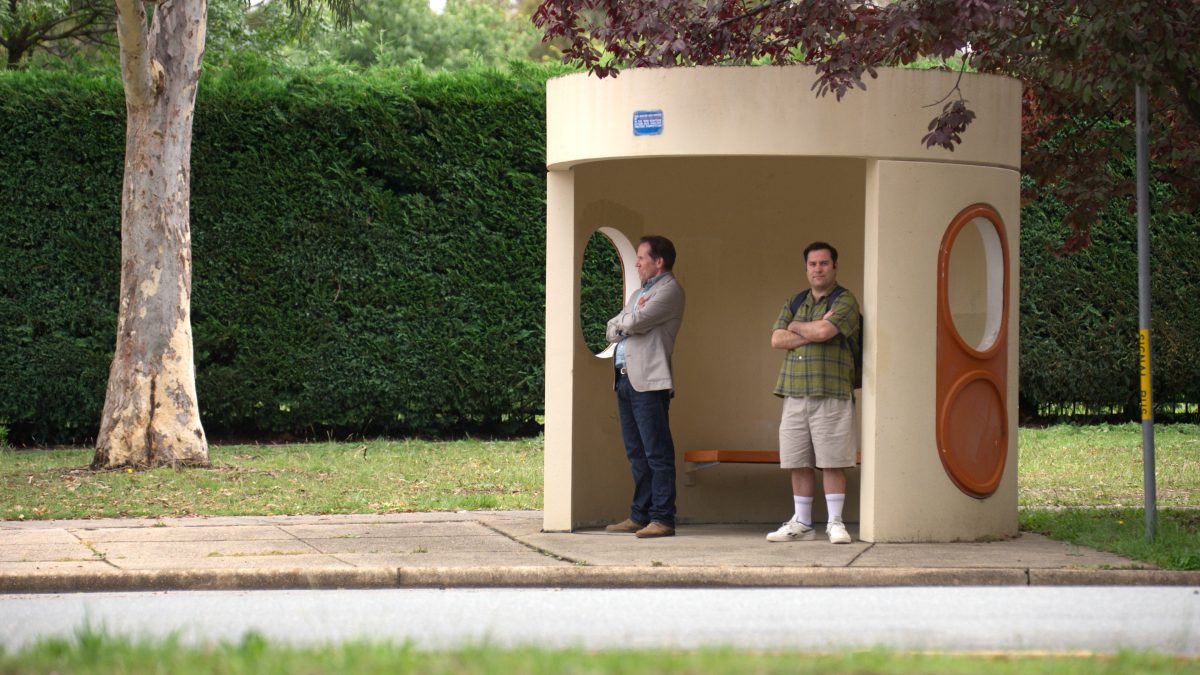 Two men in Canberra bus stop