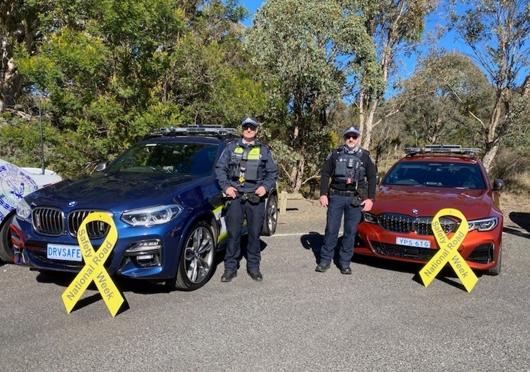 police vehicles with National Road Safety Week ribbons
