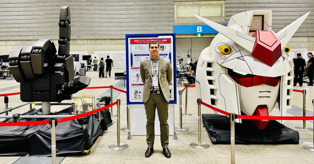 Man stands in front of robotics