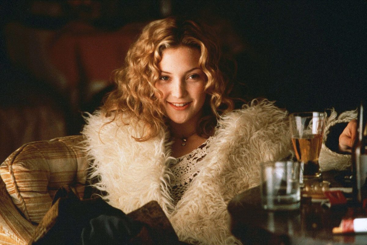 Still from Almost Famous showing a woman in a fur coat