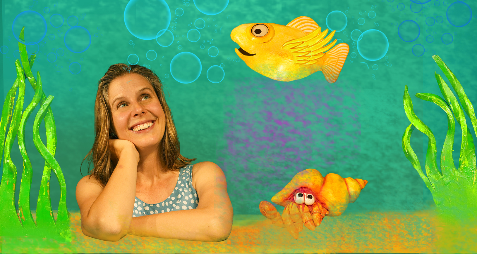 Woman looking at brightly coloured fish puppets