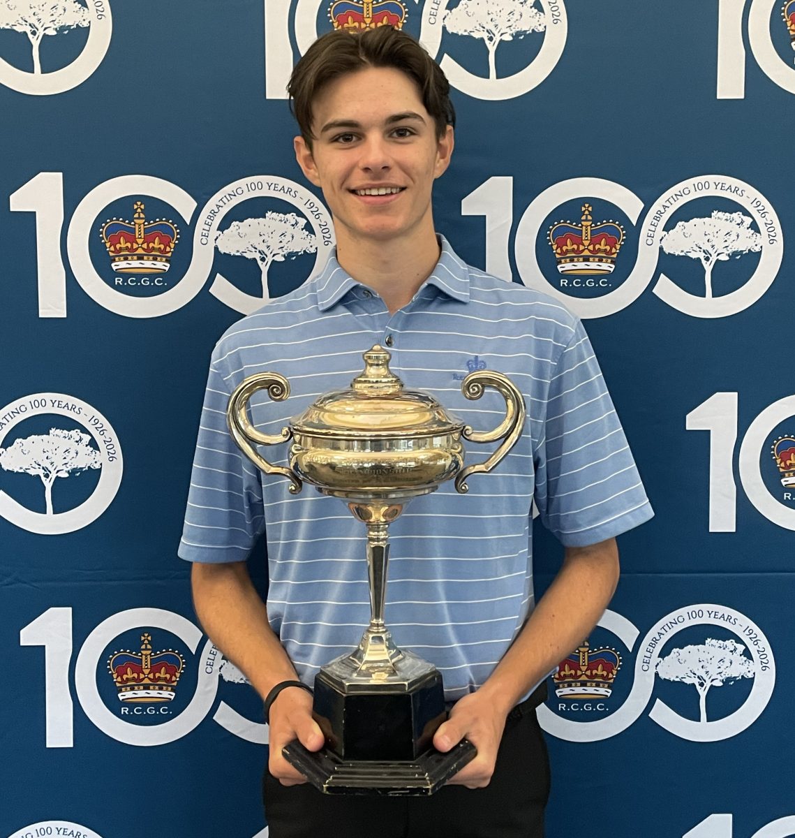 young man holding a trophy