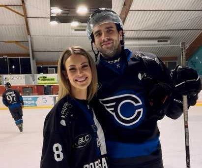 Cameron Marks and Ash in hockey gear on the ice.