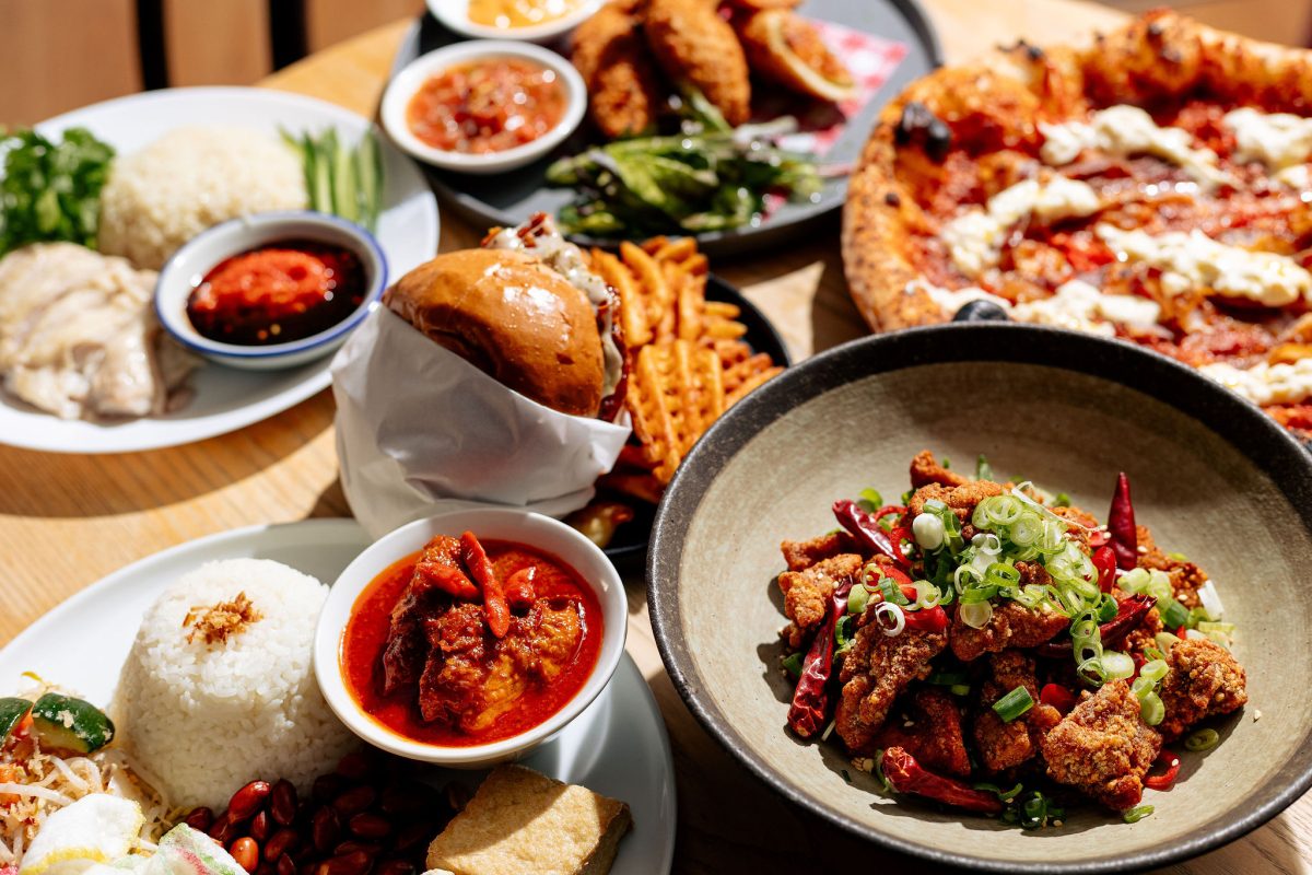 A table laden with spicy-looking dishes. 
