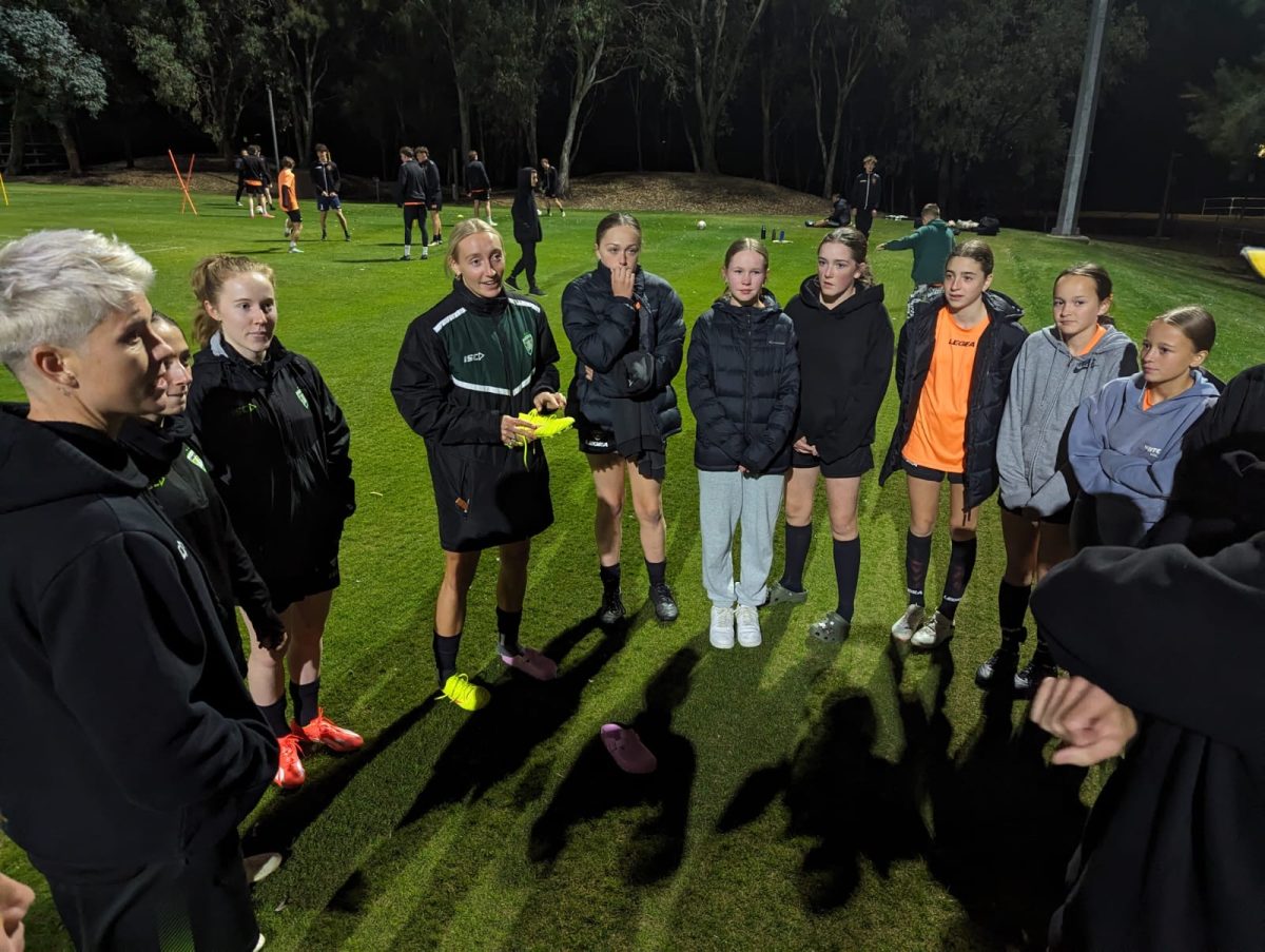 Matildas players chat with Tigers FC under-14 girls