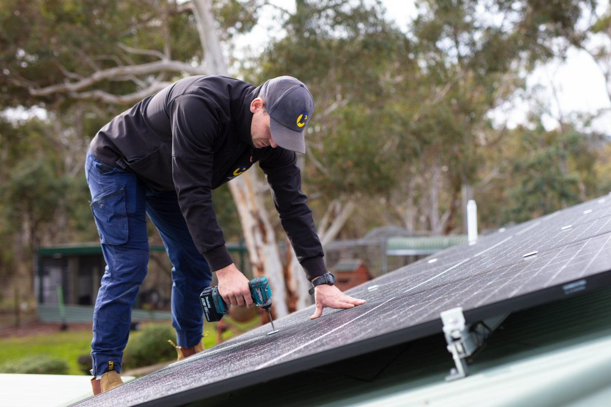 Man installing solar panels