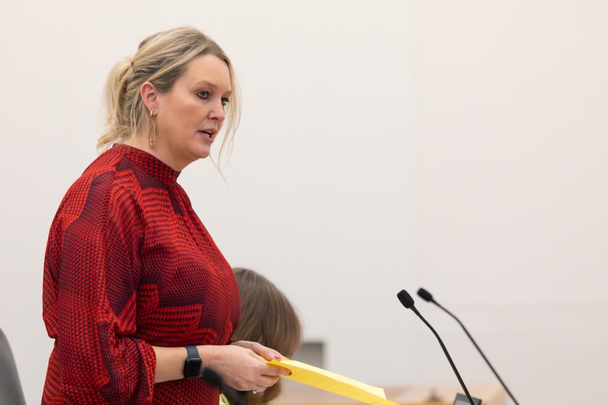 Woman speaking into microphone