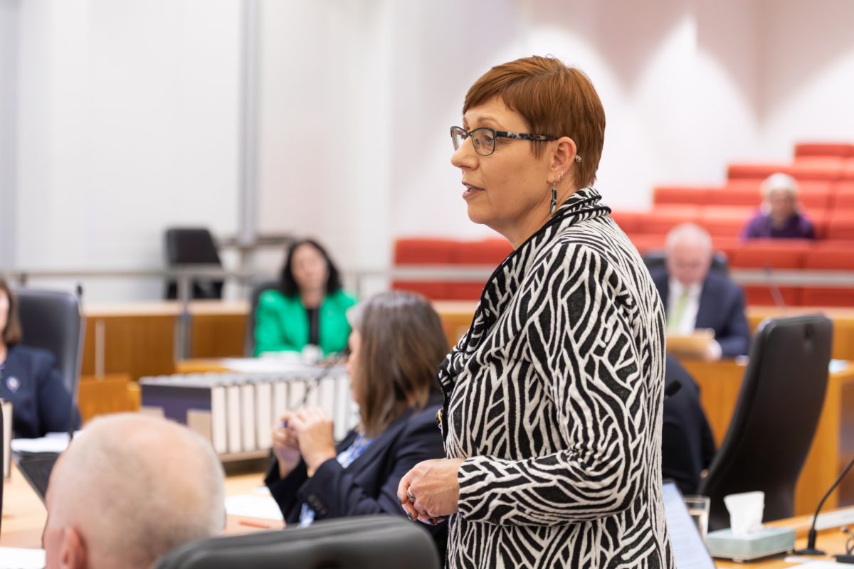 Woman speaking into microphone