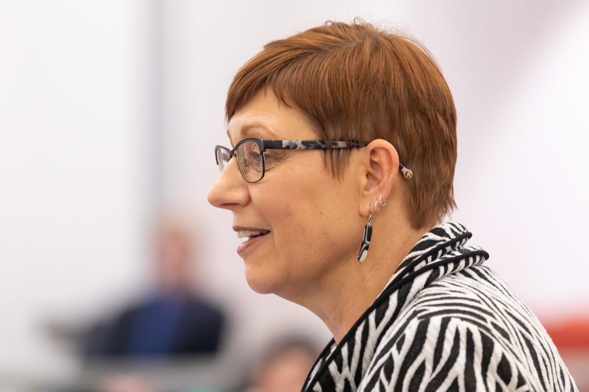 Woman speaking into microphone