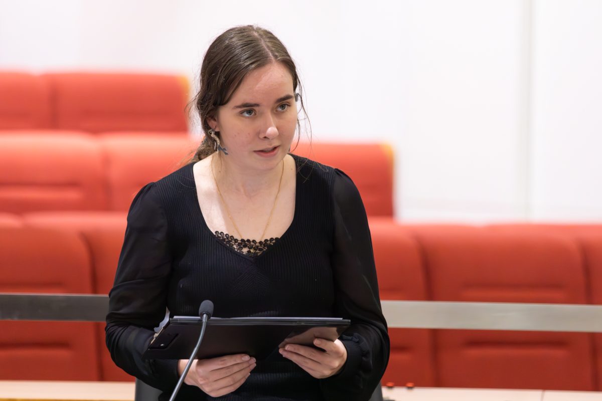 Woman speaking into microphone