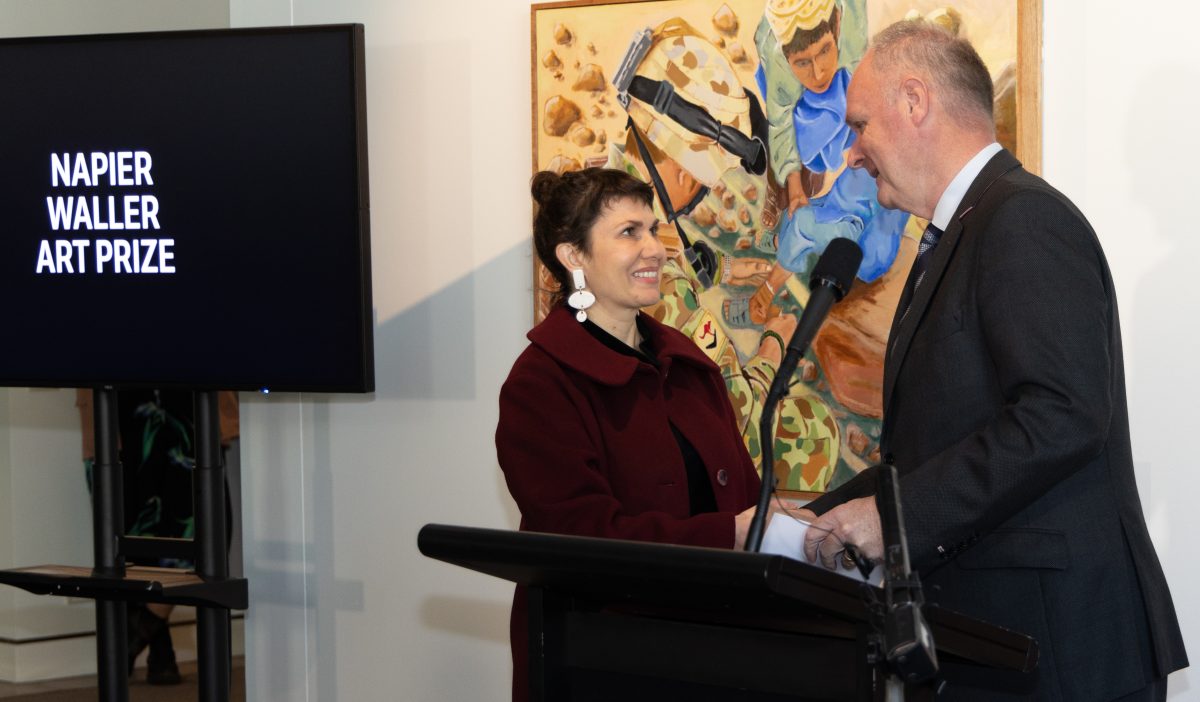 Kat Rae is congratulated by the Director of the Australian War Memorial, Matt Anderson. 