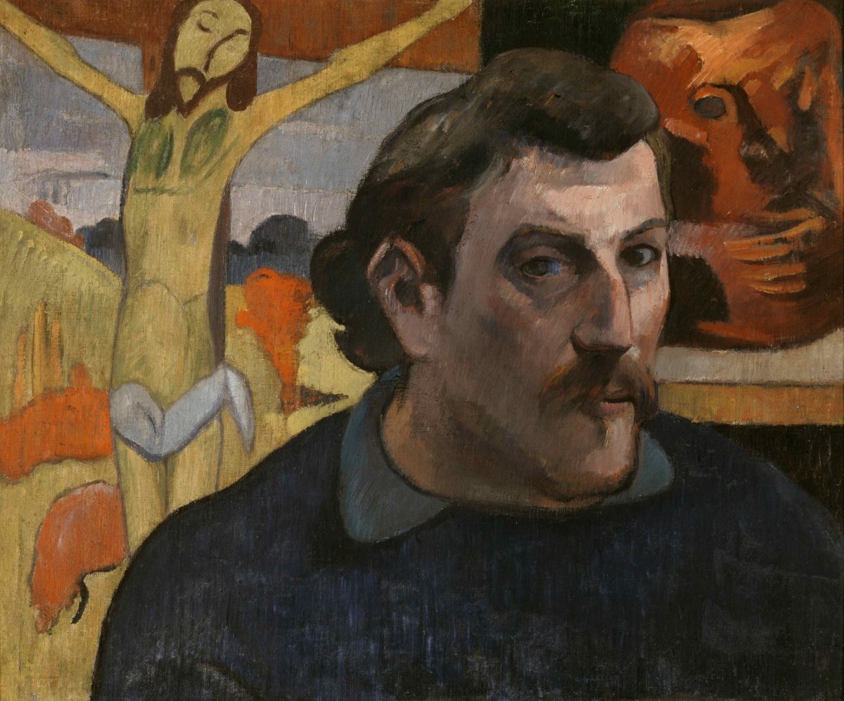 Head in foreground, yellow Crucifixion behind