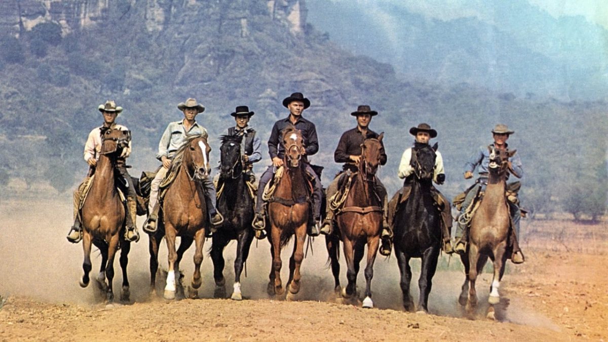 Still from The Magnificent Seven showing a group of people on horseback riding