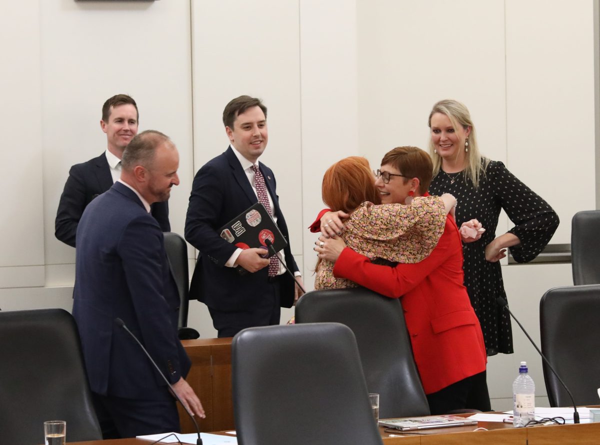 politicians celebrating the passing of a VAD bill in Parliament House