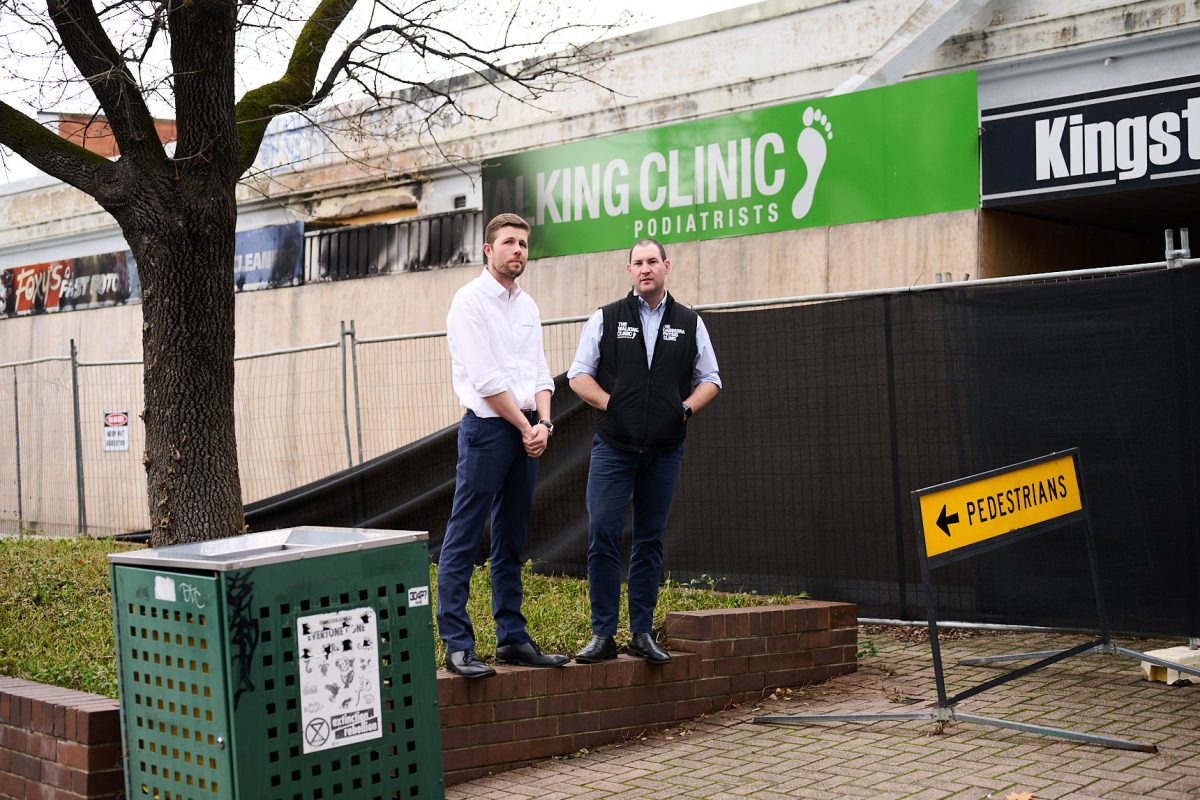 two people standing in front of The Walking Clinic Kingston space