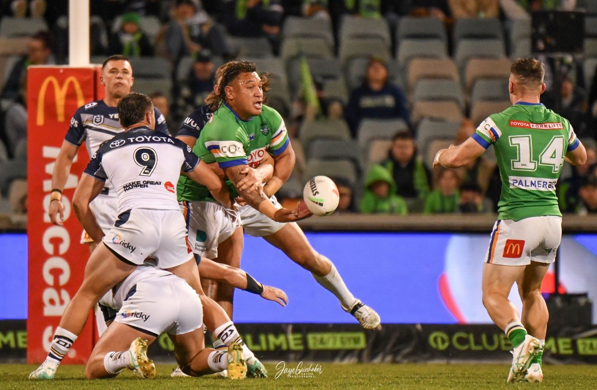 Papali'i manages a pass against a strong Cowboys defence