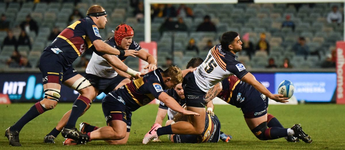 Tom Wright offloads the ball in the Brumbies win over the Highlanders on 8 June at GIO Stadium. Photo: Jayze Photography.