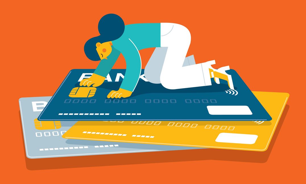 image of woman on pile of credit cards