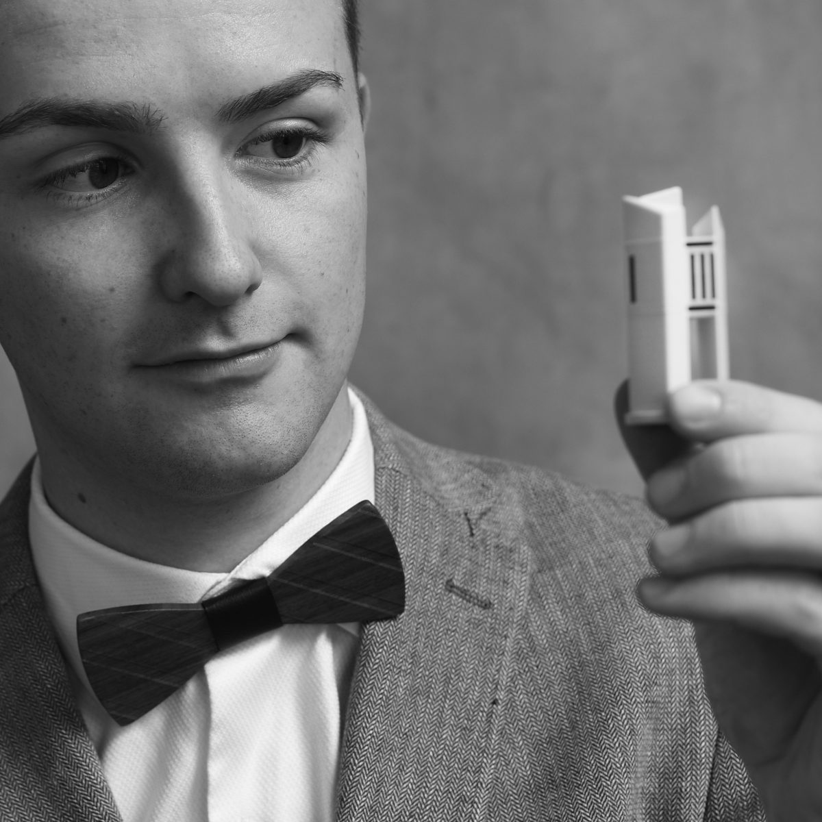 Man looking at tiny carillon 