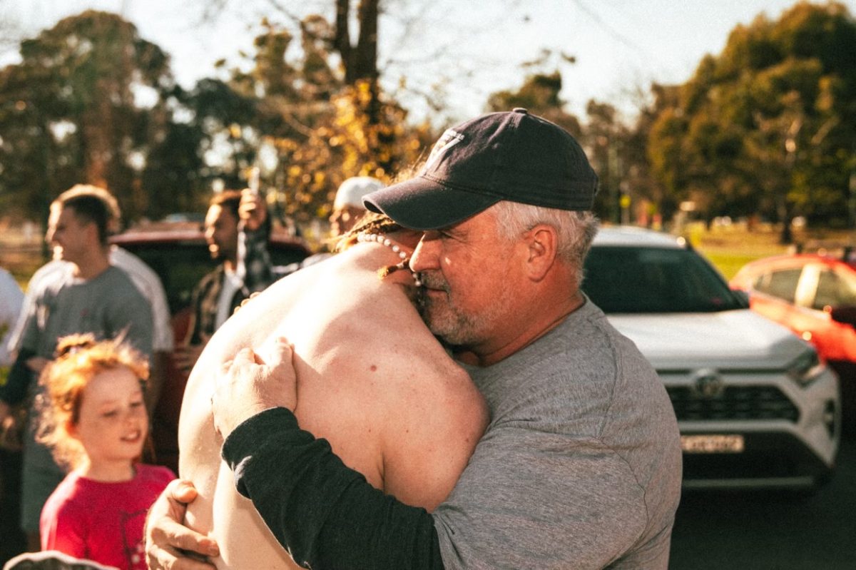 Will Hayes with his dad, Rodney, following his 100 kilometre charity run