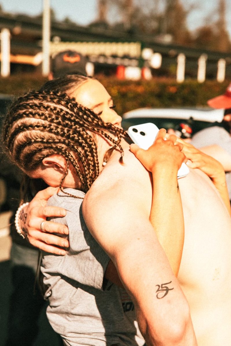 Will greeted by Miranda James after finishing his charity run