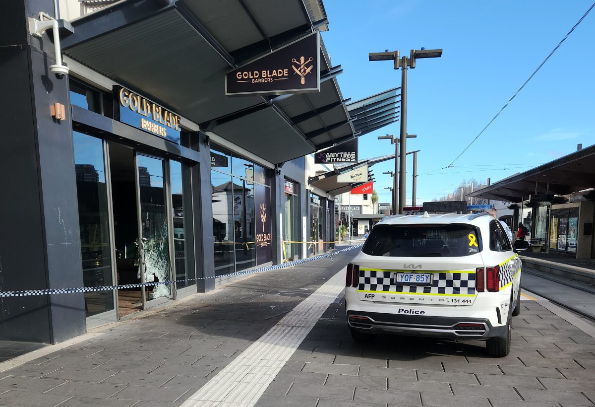 police car outside barber shop