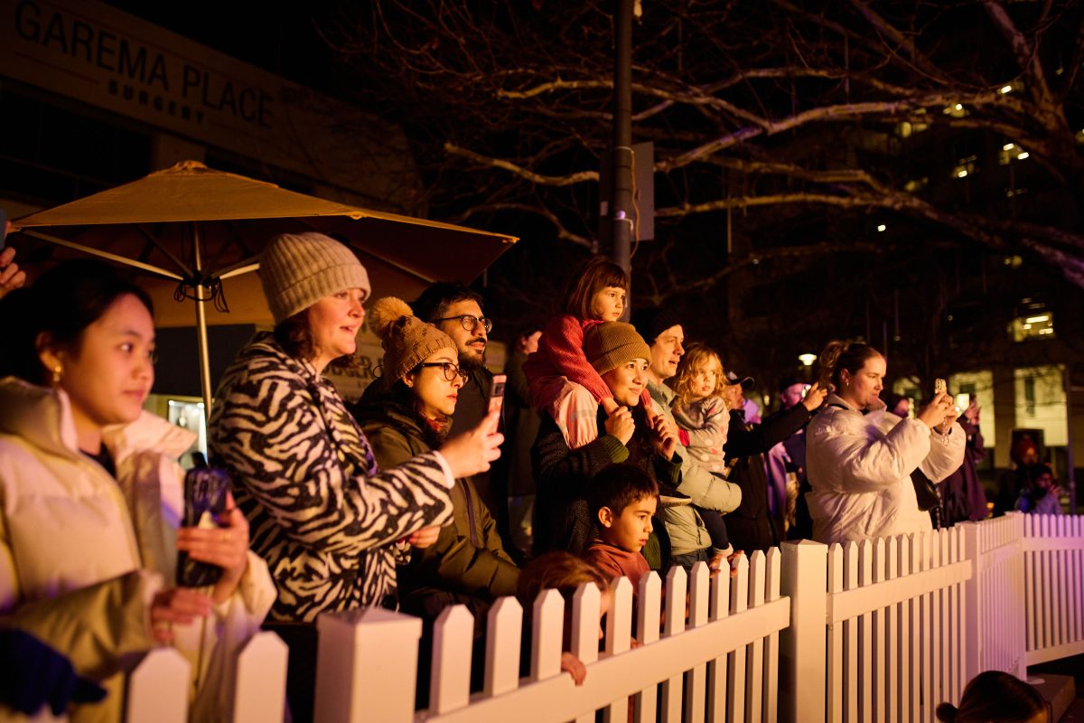 Crowds watch the fire dance display.