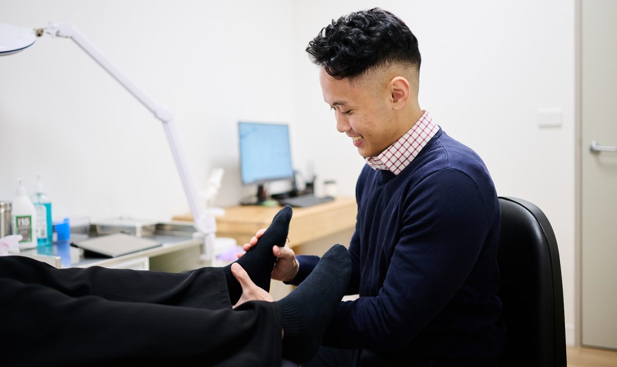 podiatrist Kenny Le treating a patient