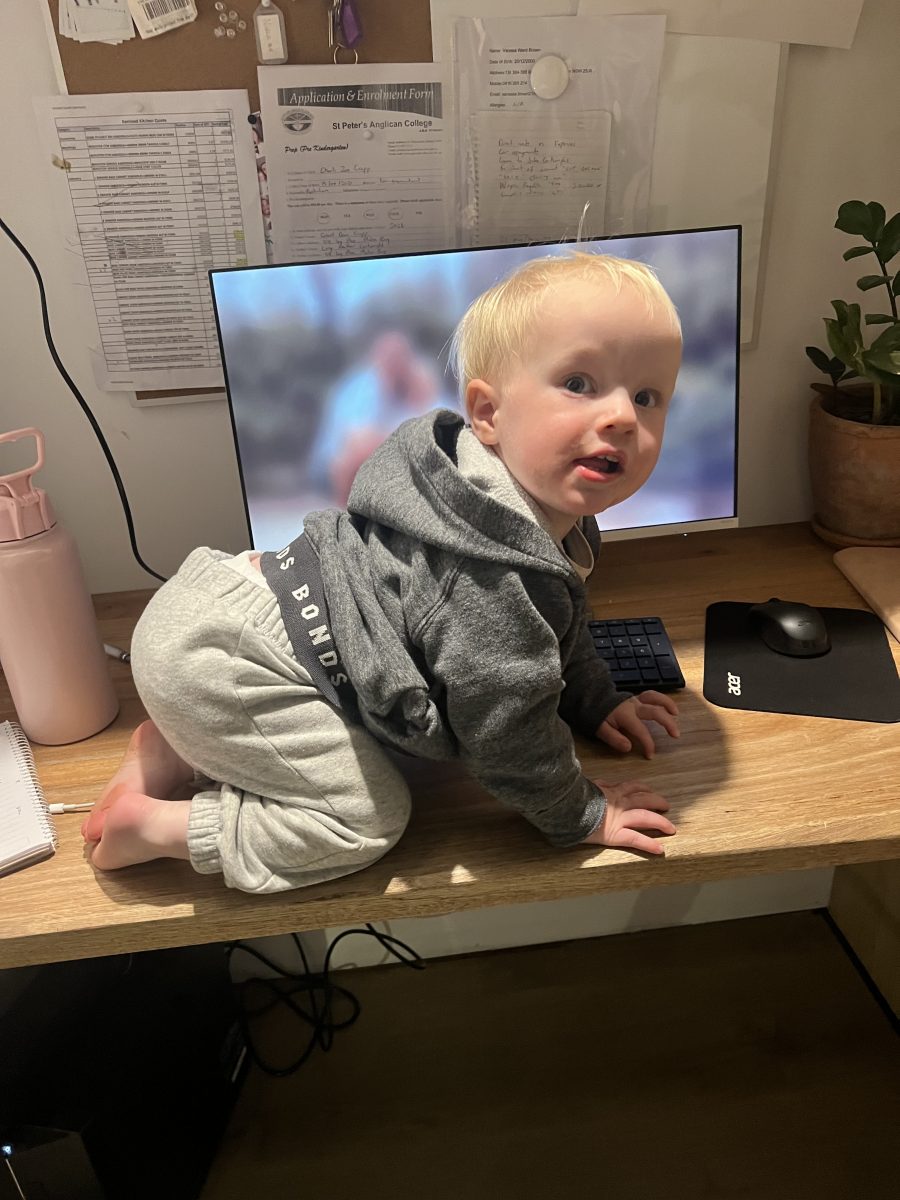 child crawling on a desk