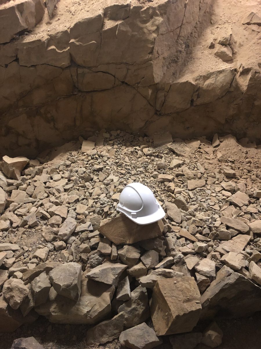 Close-up of rocks with hard hat sitting on them