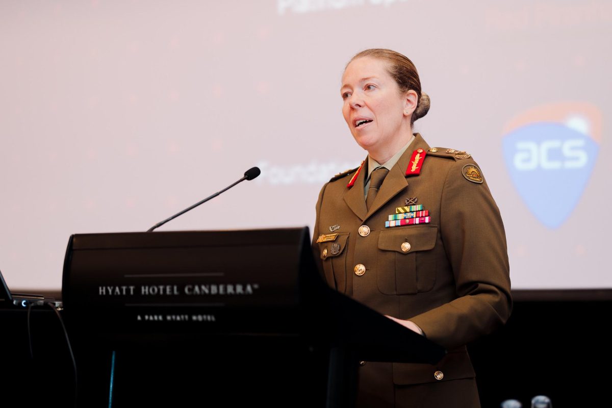 army officer giving a talk at lectern