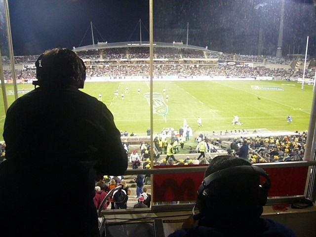Tim Gavel commentating from the ABC box at GIO Stadium