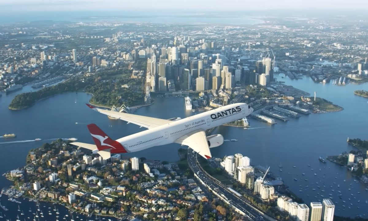 Qantas A350 flying over harbour