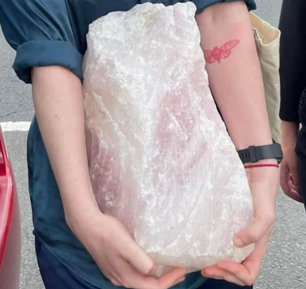 woman carrying a large crystal