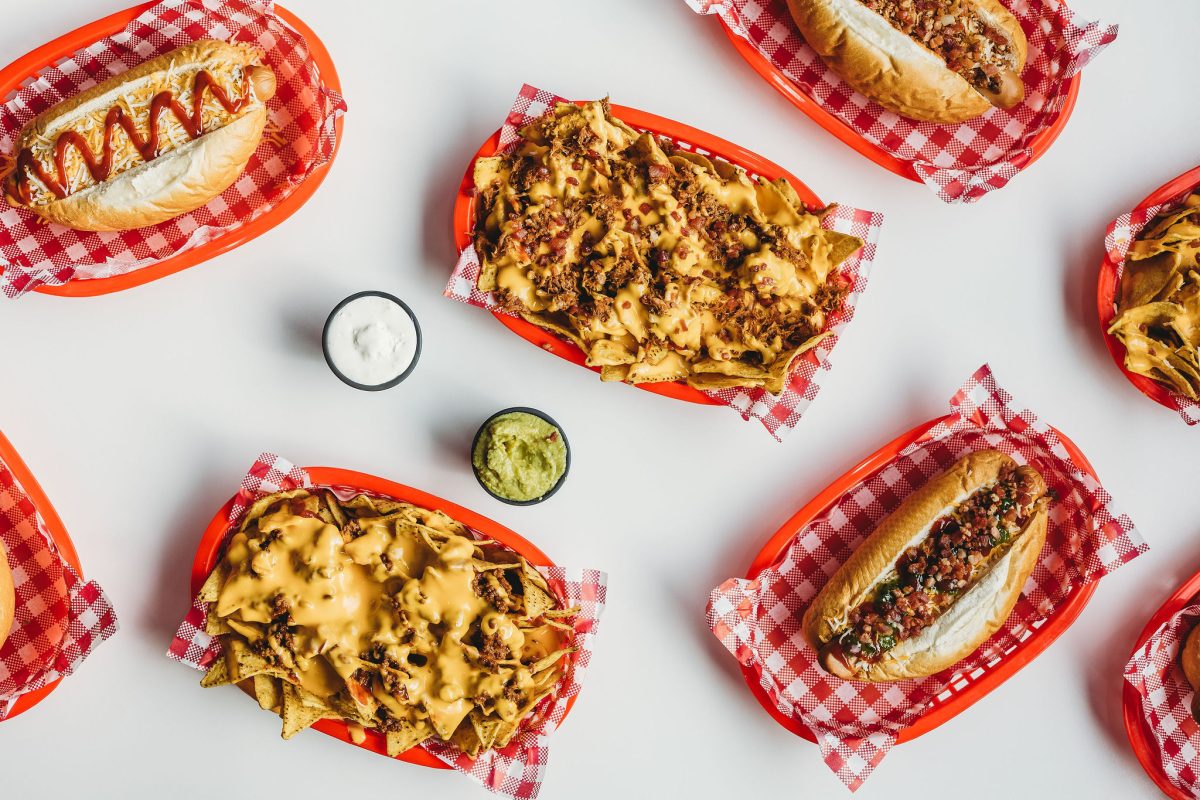 An aerial shot of Goodberry's savoury menu items such as nachos and hotdogs.